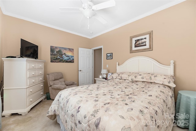 carpeted bedroom featuring ceiling fan and crown molding