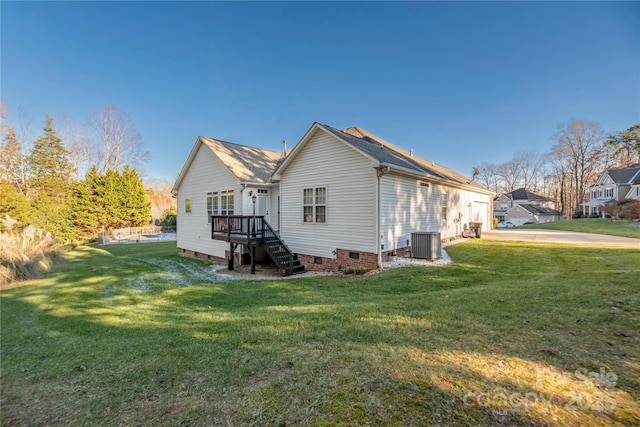 back of property with cooling unit and a yard