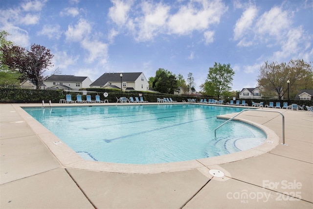 view of pool featuring a patio