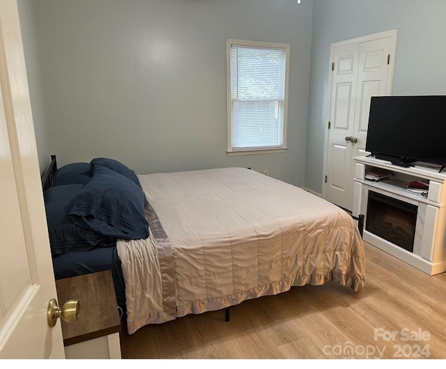 bedroom with light wood-type flooring