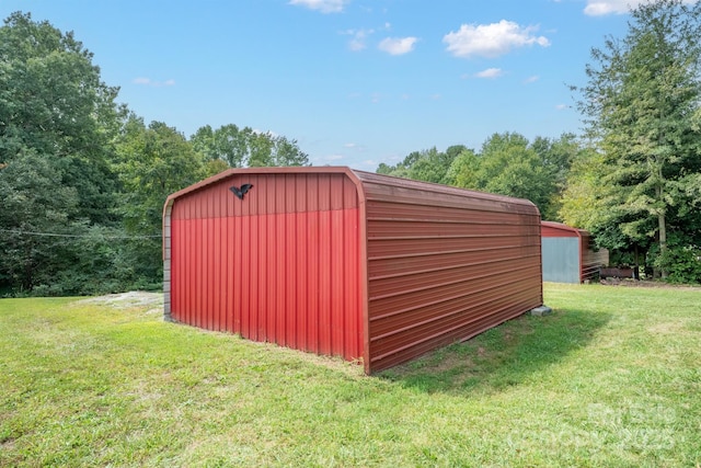 view of outbuilding with a lawn