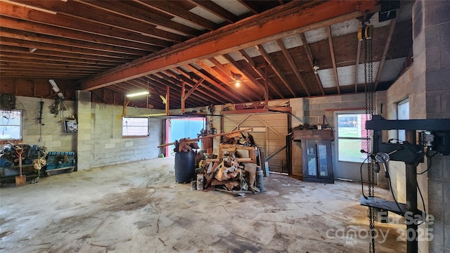 garage with concrete block wall