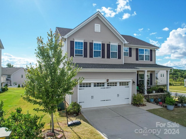 view of front of house featuring a garage and a front yard