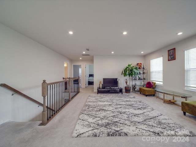 living room featuring light carpet