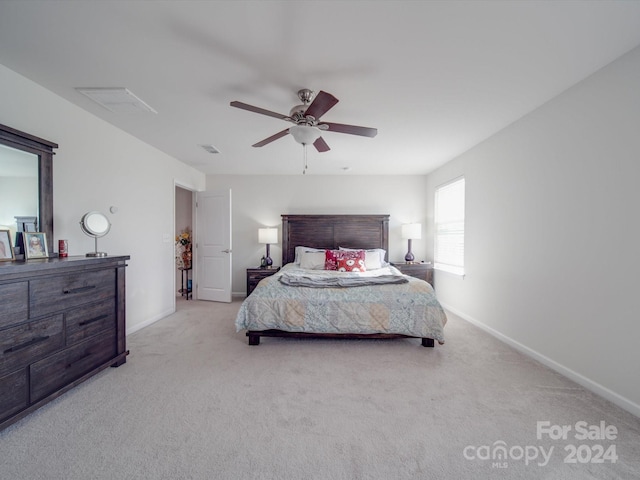 carpeted bedroom with ceiling fan