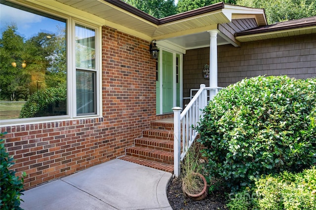 property entrance featuring covered porch