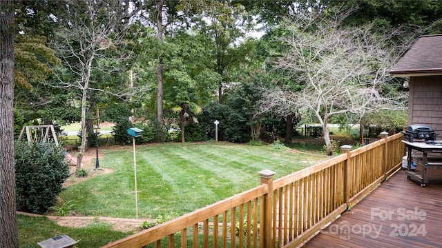 view of yard featuring a wooden deck