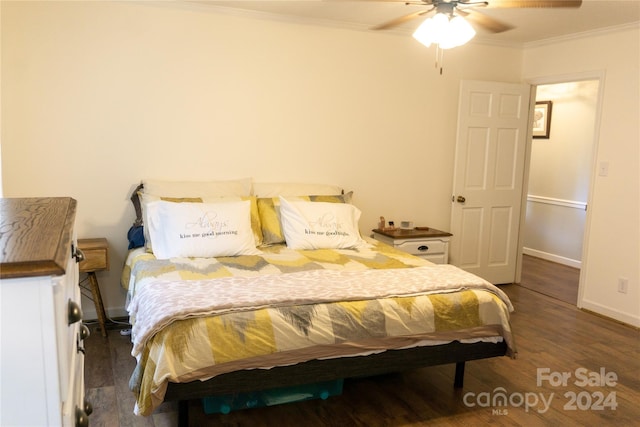 bedroom featuring crown molding, ceiling fan, and dark hardwood / wood-style floors