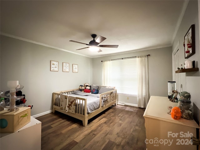 bedroom featuring dark wood-type flooring, ceiling fan, and ornamental molding