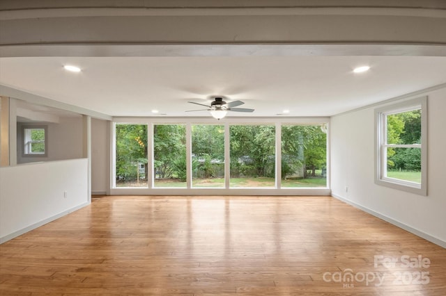 spare room featuring recessed lighting, ceiling fan, baseboards, and wood finished floors