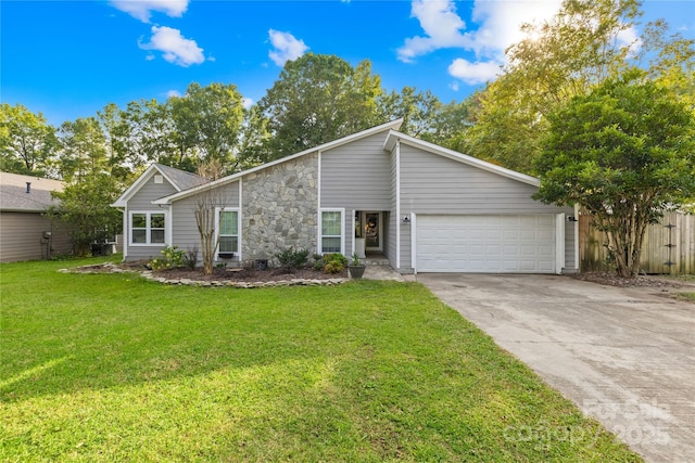 view of front of house with a garage and a front lawn