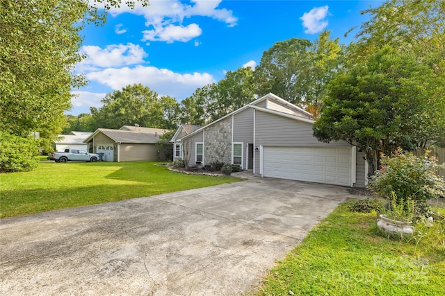 single story home with a garage and a front lawn