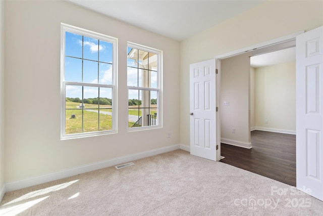 1034 Heath Helms Rd, Monroe, NC 28110 - spare room featuring dark carpet and healthy amount of natural light