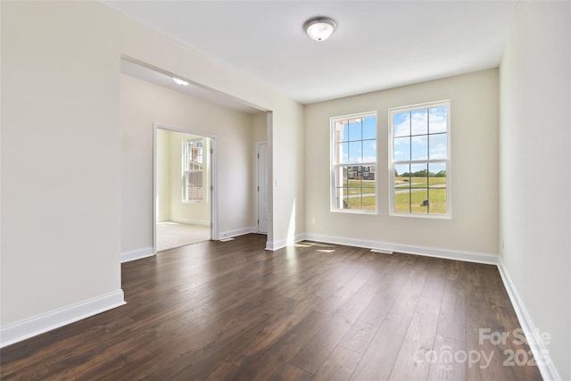 1034 Heath Helms Rd, Monroe, NC 28110 - unfurnished room featuring plenty of natural light and dark wood-type flooring