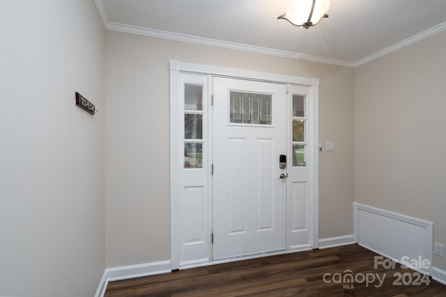 foyer with ornamental molding and dark wood-type flooring