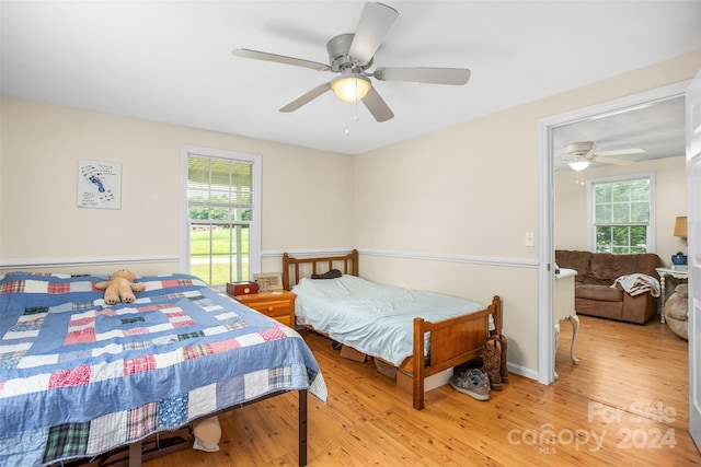 bedroom featuring ceiling fan and hardwood / wood-style flooring