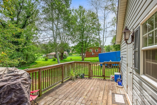 deck featuring a yard