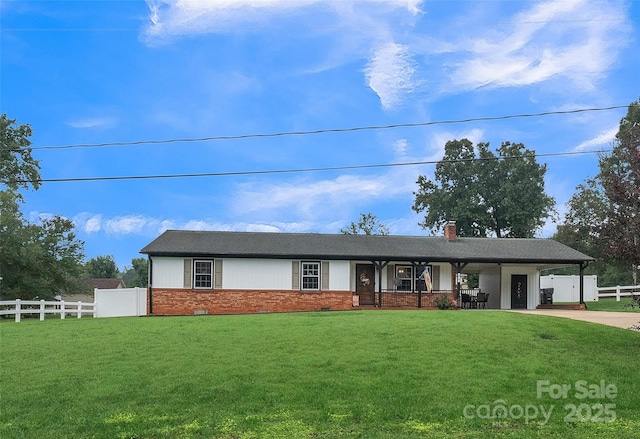 ranch-style home featuring a front yard and a carport