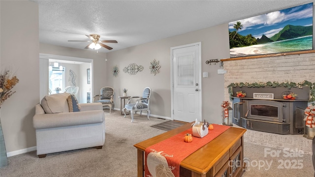 living room with light carpet, a textured ceiling, and ceiling fan