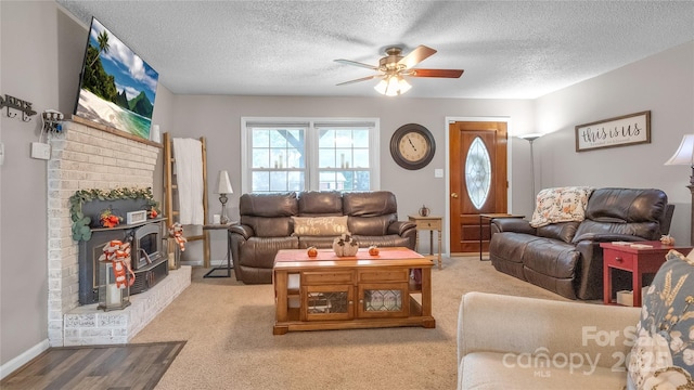 carpeted living room with ceiling fan and a textured ceiling