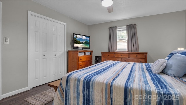 bedroom featuring dark hardwood / wood-style floors, a closet, and ceiling fan