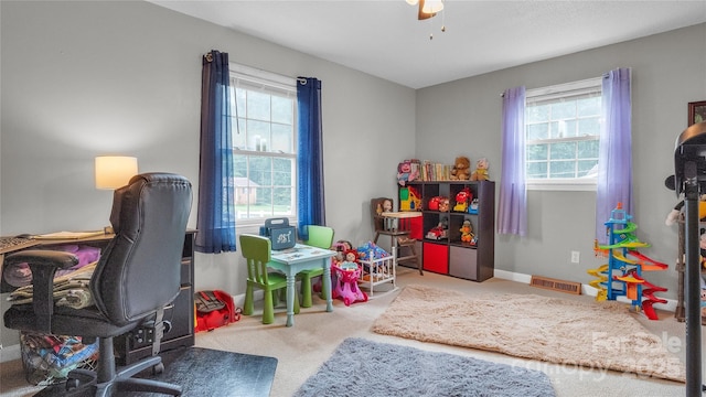 interior space featuring carpet flooring and ceiling fan