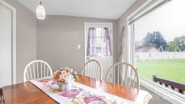 dining room with lofted ceiling