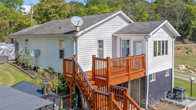 rear view of house featuring a deck