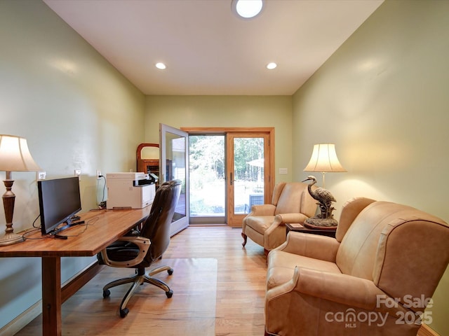 office space featuring light wood-style flooring and recessed lighting