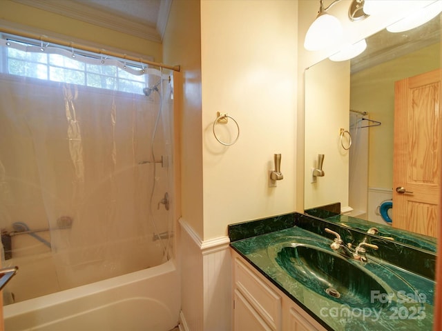 bathroom featuring ornamental molding, shower / bathing tub combination, and vanity