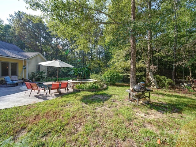 view of yard with a patio and a hot tub