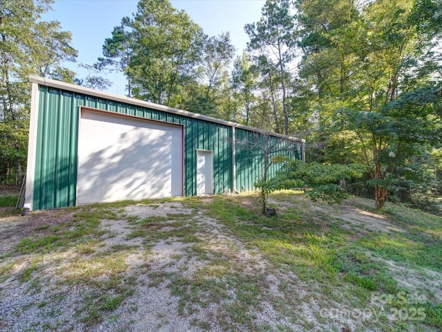 detached garage featuring driveway