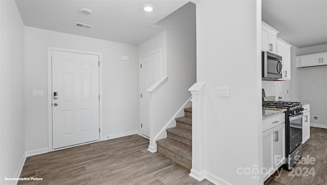 foyer entrance with wood-type flooring