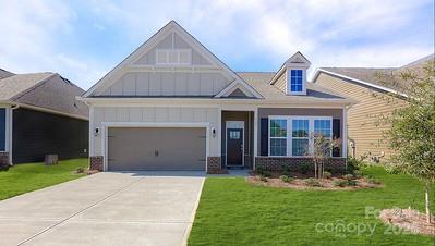 view of front of home featuring a garage and a front lawn