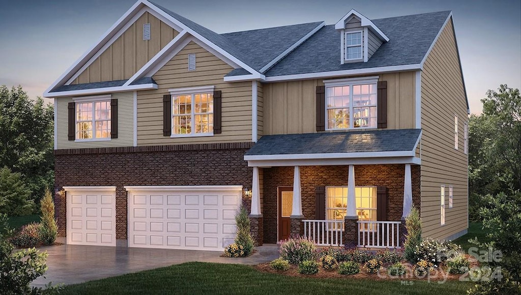 craftsman-style home featuring a garage and a porch