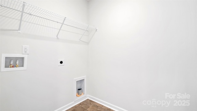 clothes washing area with laundry area, hookup for a washing machine, baseboards, and electric dryer hookup