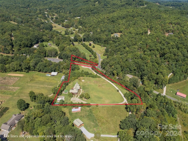 birds eye view of property featuring a rural view