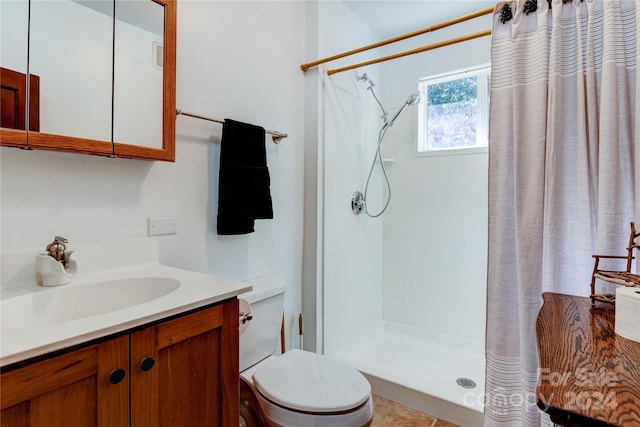 bathroom with vanity, tile patterned floors, toilet, and a shower with shower curtain