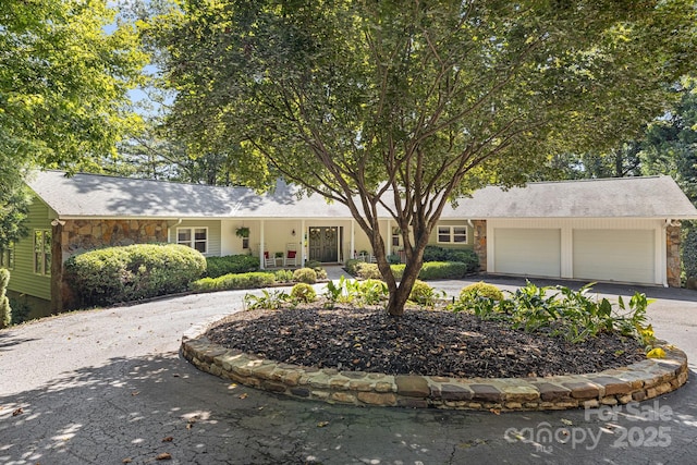 ranch-style home featuring a garage