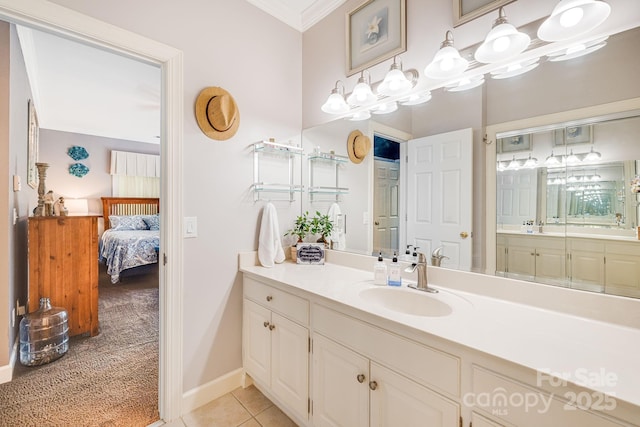 bathroom with vanity, ornamental molding, and tile patterned floors