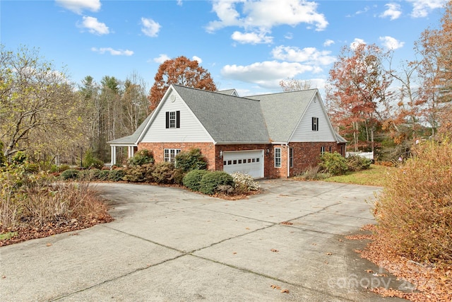 view of side of property featuring a garage