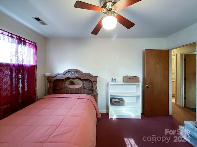 carpeted bedroom with ceiling fan