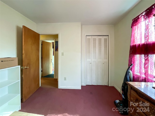 unfurnished bedroom with light carpet, multiple windows, and a closet