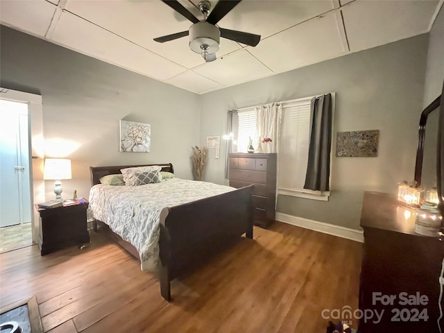 bedroom with ceiling fan and hardwood / wood-style floors