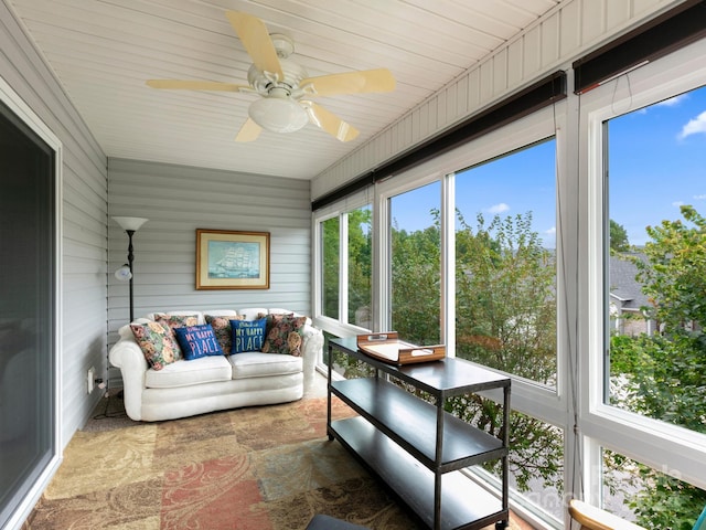 sunroom / solarium with ceiling fan