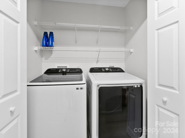 washroom featuring washer and dryer