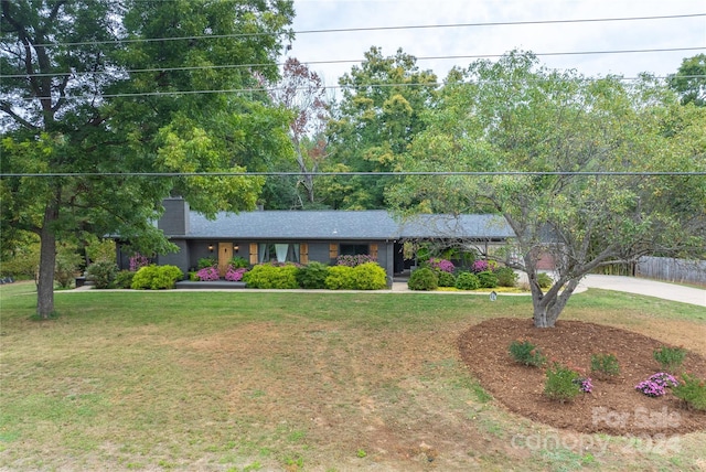 ranch-style house with a front lawn