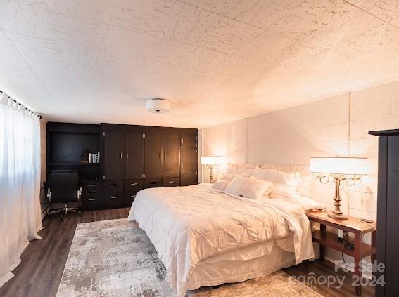 bedroom featuring dark hardwood / wood-style flooring