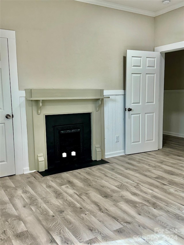 interior details with hardwood / wood-style floors and crown molding