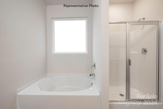 bathroom with plus walk in shower